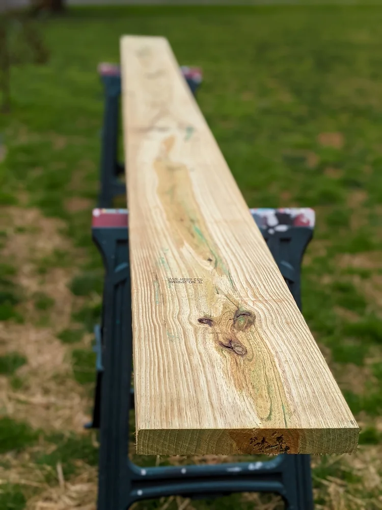 pressure treated 2x12x16 resting on stands